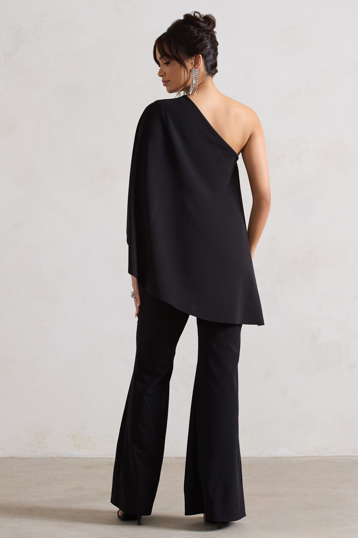 Pristine | Black Asymmetric Flared-Leg Jumpsuit With Cape Sleeve