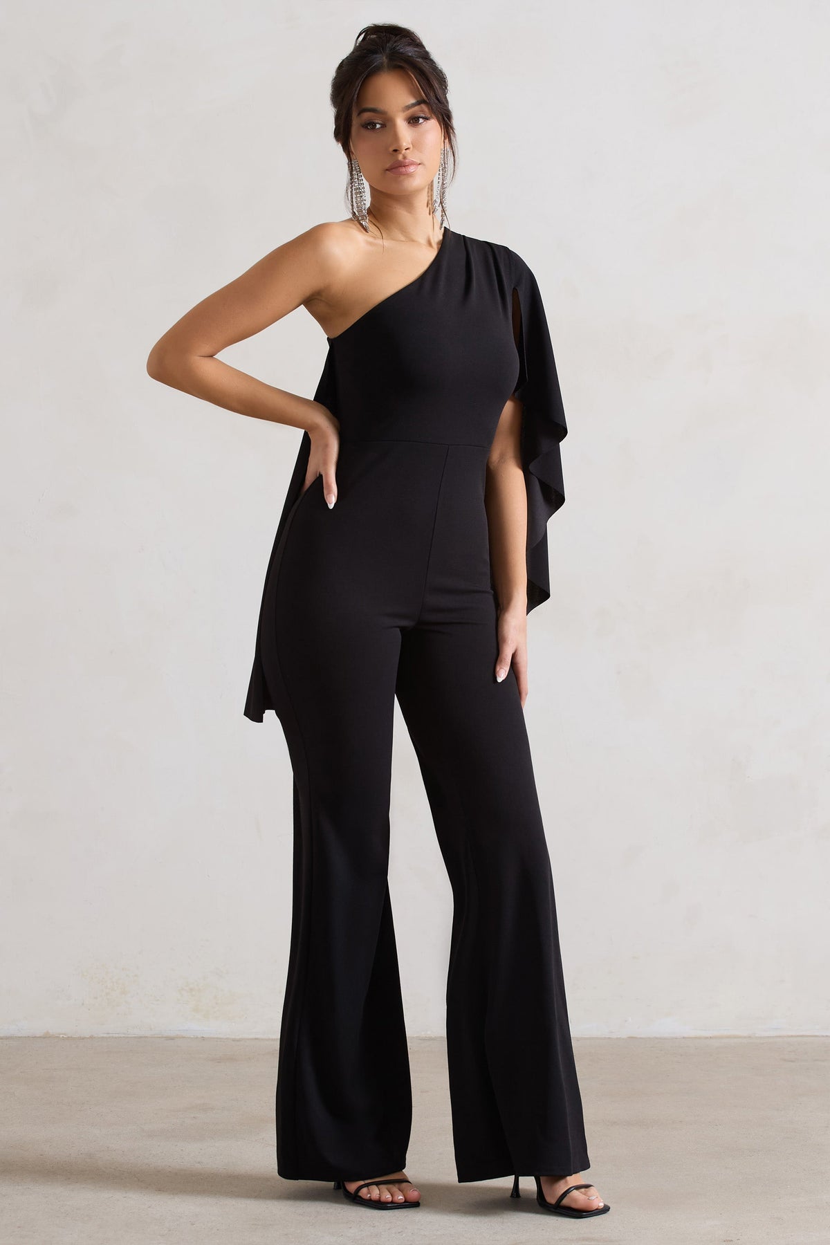 Pristine | Black Asymmetric Flared-Leg Jumpsuit With Cape Sleeve